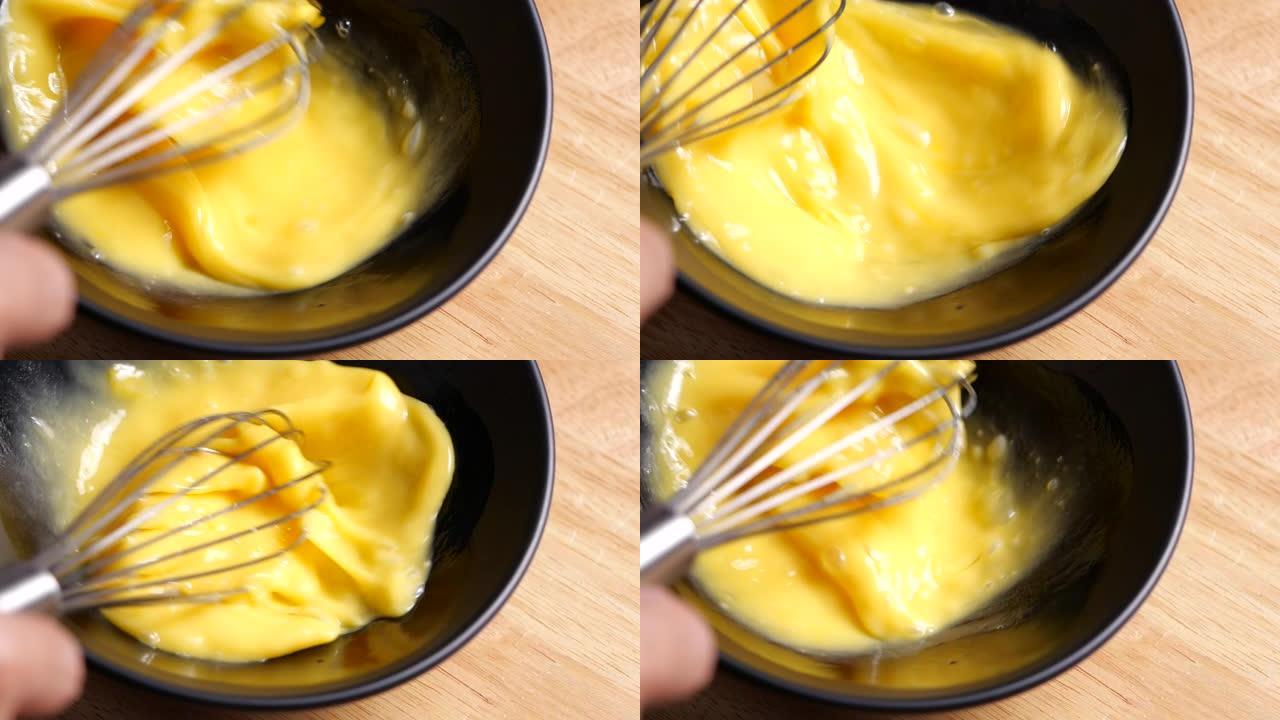 慢动作准备自制煎蛋与鸡蛋混合的作物镜头