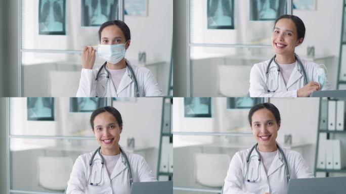 欢乐的女医生摘下医用口罩，对着镜头微笑