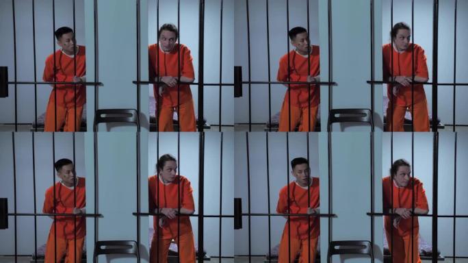两个囚犯隔着墙谈话