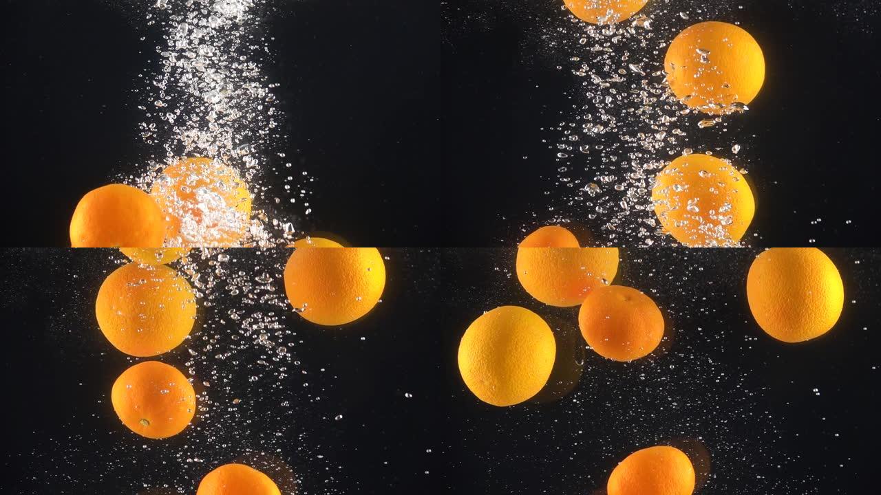 橘子掉进水里。慢动作