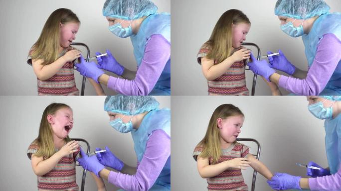 医生给一个小女孩注射疫苗。这个女孩害怕并哭泣。