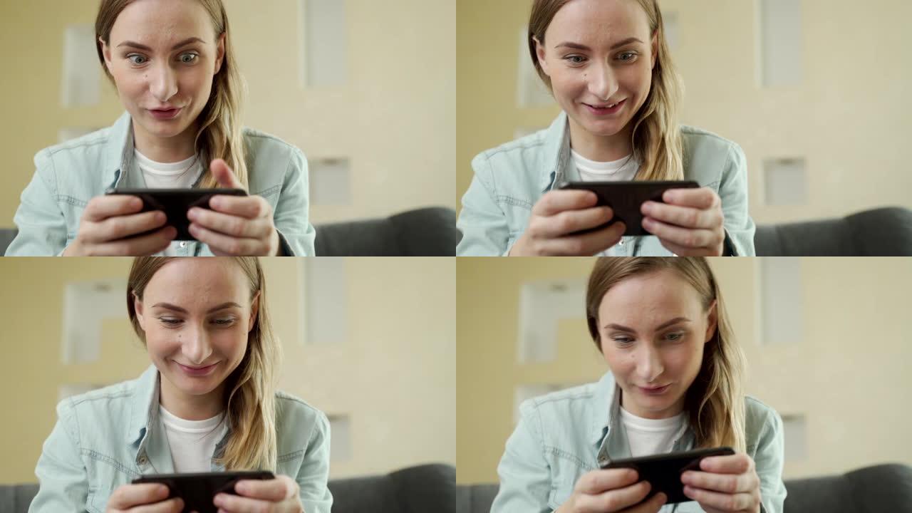 开朗快乐，微笑的年轻女子玩智能手机游戏，水平拿着手机作为通过比赛关卡，汽车游戏