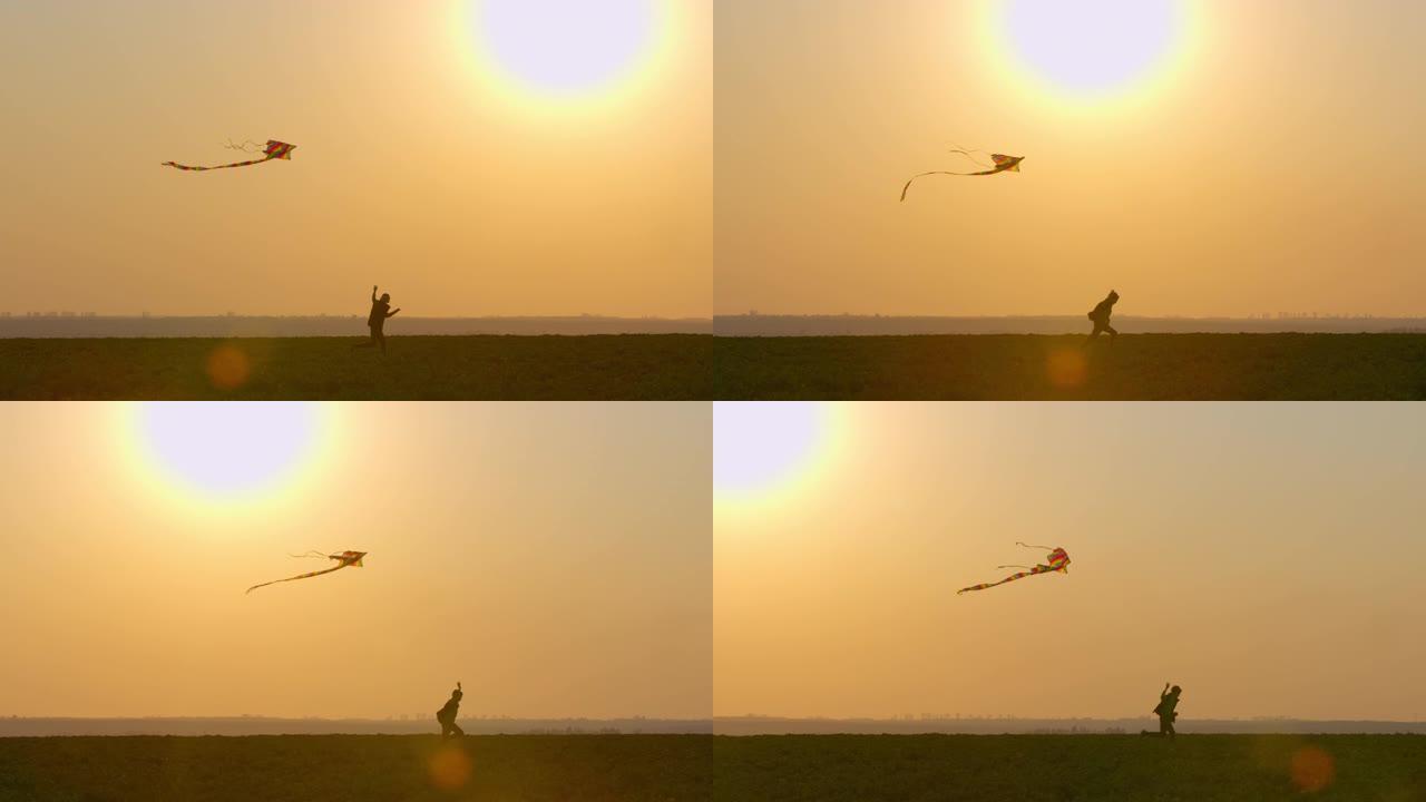 日落时，一个男孩正在天上玩风筝。4K