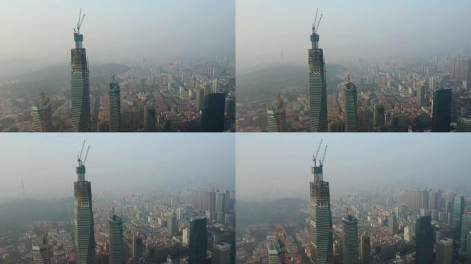 日落时间青岛市市中心摩天大楼建设顶部空中全景4k中国