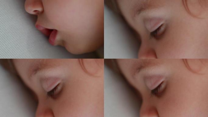 婴儿睡觉特写微距脸。婴儿男孩在午睡时流口水