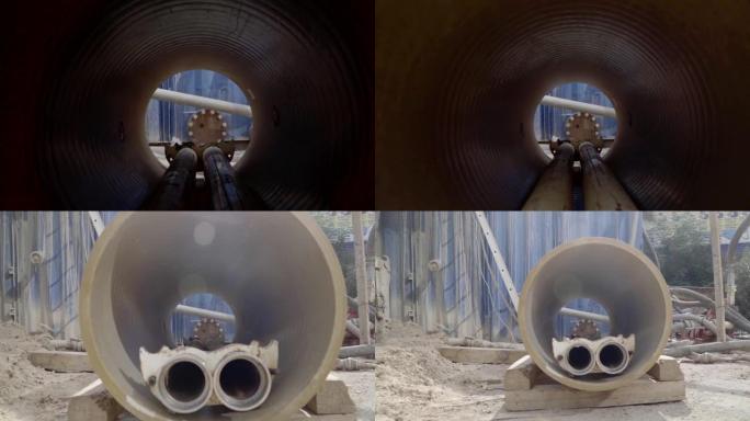 在施工现场用混凝土制成的空管隧道上进行旋流轨道射击，结构孔准备工作。
