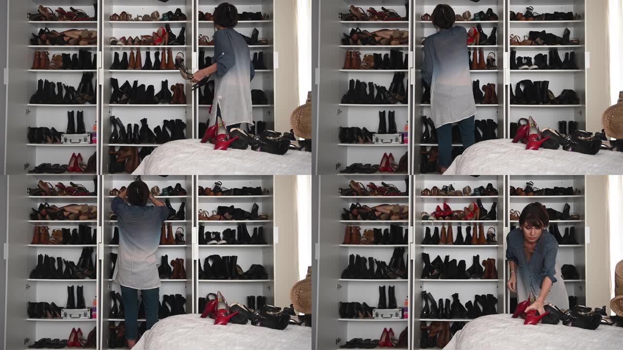 女人独自在大衣柜里布置许多鞋子
