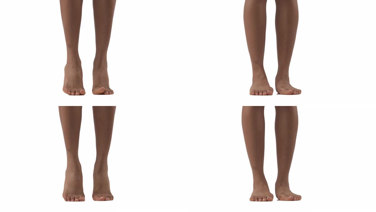 特写的苗条女性的腿。非洲妇女脚跟站立，踮起脚尖。孤立，在白色背景上