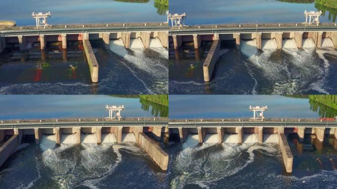 水库中的水电站大坝或水电站，无人机的鸟瞰图。通过闸门排水，水电