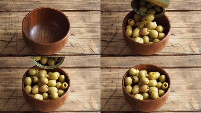 罐装橄榄从锡罐倒入木碗中