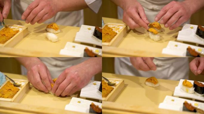 一家高档日本寿司餐厅的厨师正在用海胆手工制作nigiri寿司