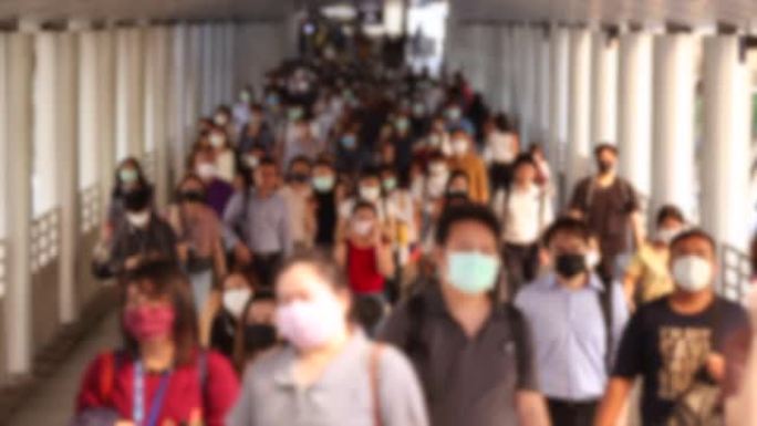 人群戴口罩以保护corovvirus或新型冠状病毒肺炎爆发。