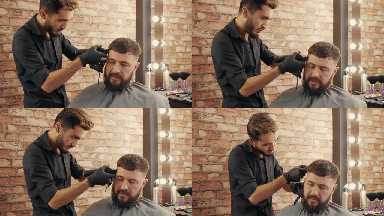 年轻的理发师在理发店为英俊的男顾客理发