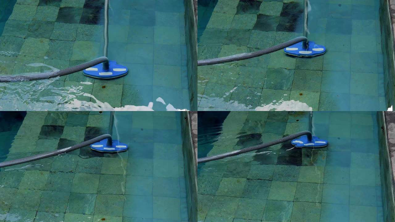 用手动水下真空吸尘器清洁游泳池。服务和技术。