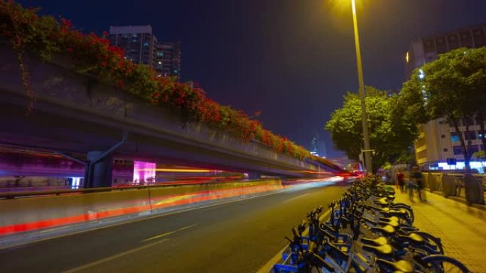 夜间照明广州市市中心自行车租赁停车场交通路口延时全景4k中国