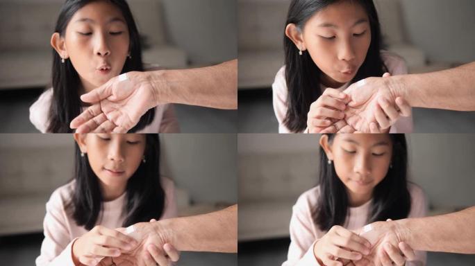 亚洲女孩拳头帮助她祖母的手，生命概念。