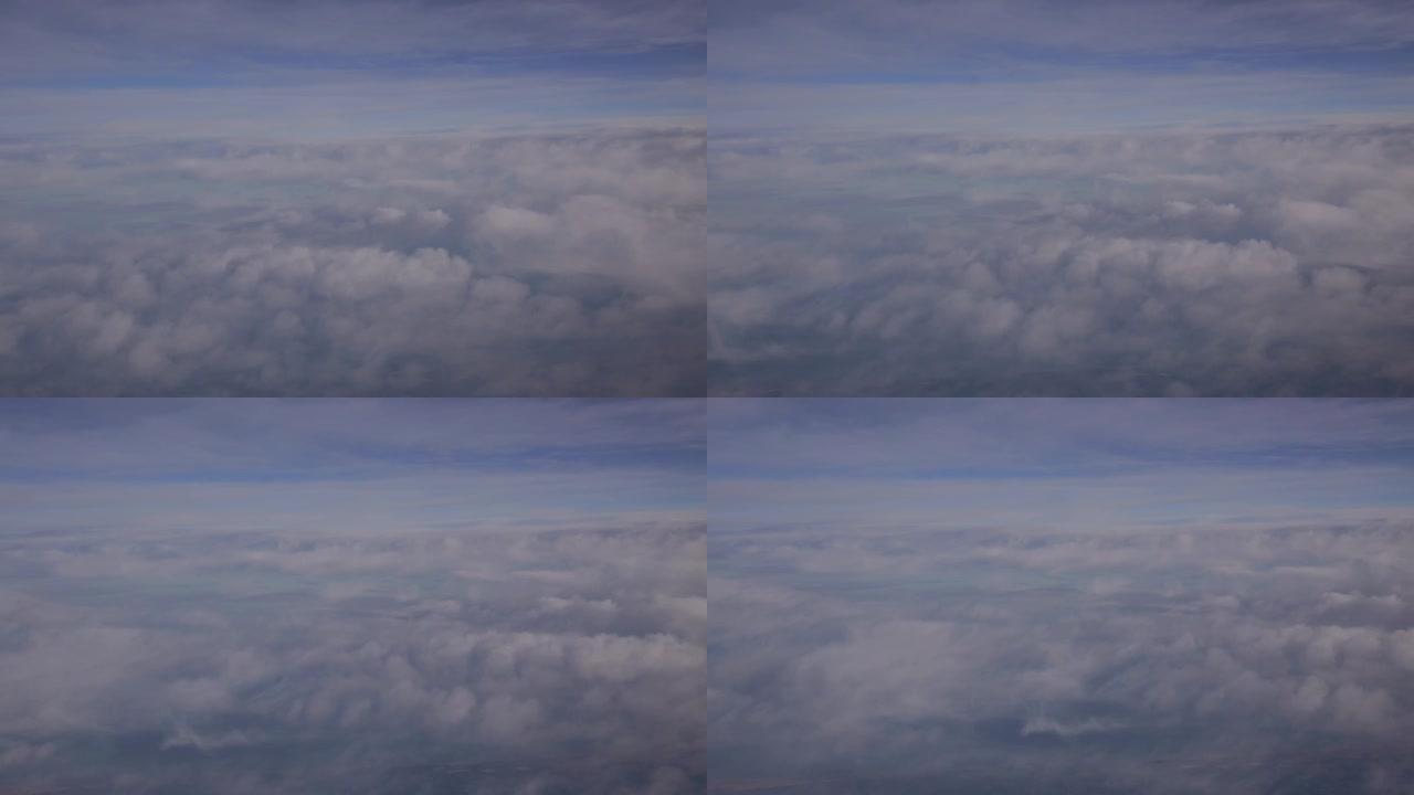 空中漂流在天空中以柔和的蓝色背景穿越云层