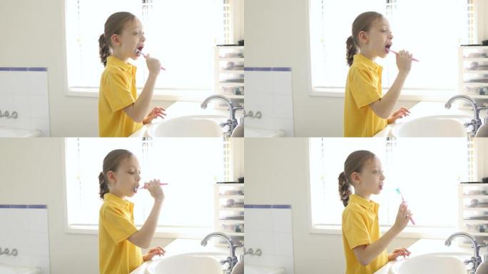 年轻的女学生刷牙