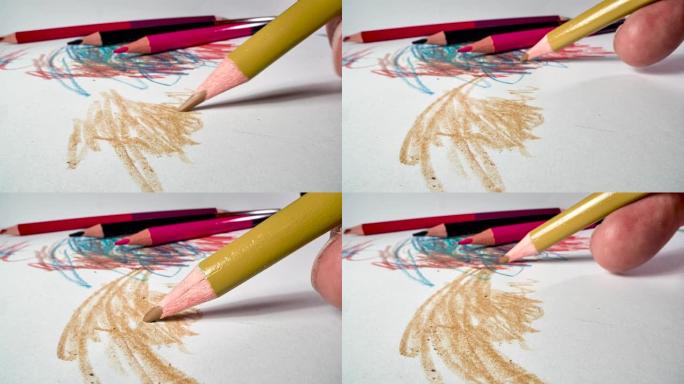 在白色画纸上绘图蜡笔笔尖彩色描绘