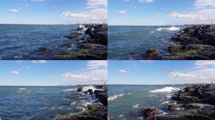 海浪在意大利海岸破碎成大理石巨石