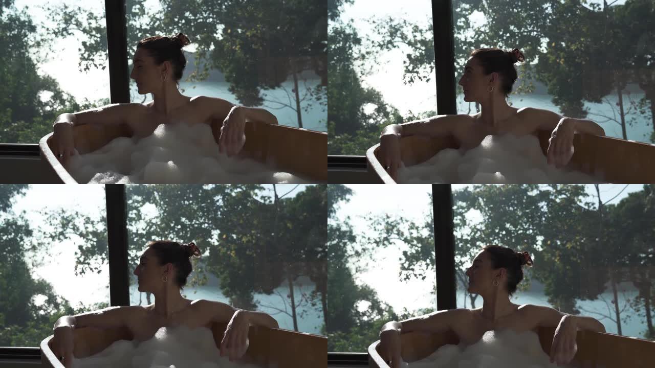 女人洗热水澡，欣赏风景