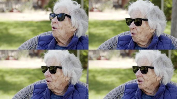 时髦、有趣、美丽、敏锐、聪明的老年酷高级高加索妇女在夏天户外戴着旅行者太阳镜