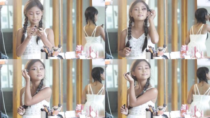 一位可爱的长发亚洲女学生在化妆课上使用睫毛刷。