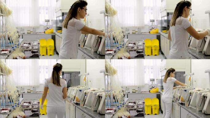 实验室中从事血液和血浆过滤工作的年轻护士