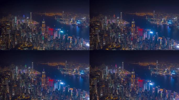 夜间照明飞行在香港市中心港口空中全景4k延时