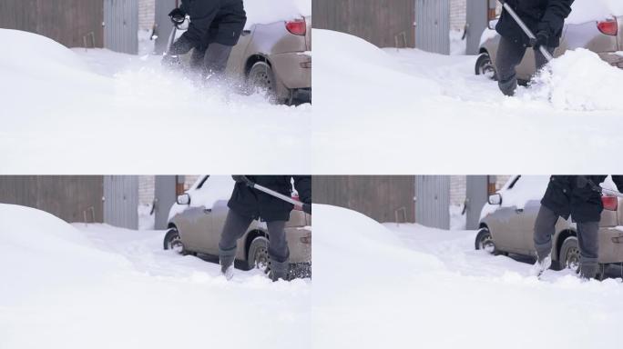 异常降雪气候变化一男子从雪中挖车