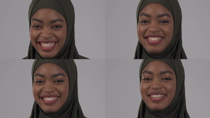 戴着头巾的迷人非洲女人真诚地笑。真实情感概念。隔离在白色背景上