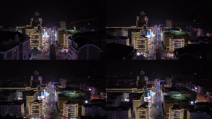 夜间照明青岛市著名步行街空中全景4k中国