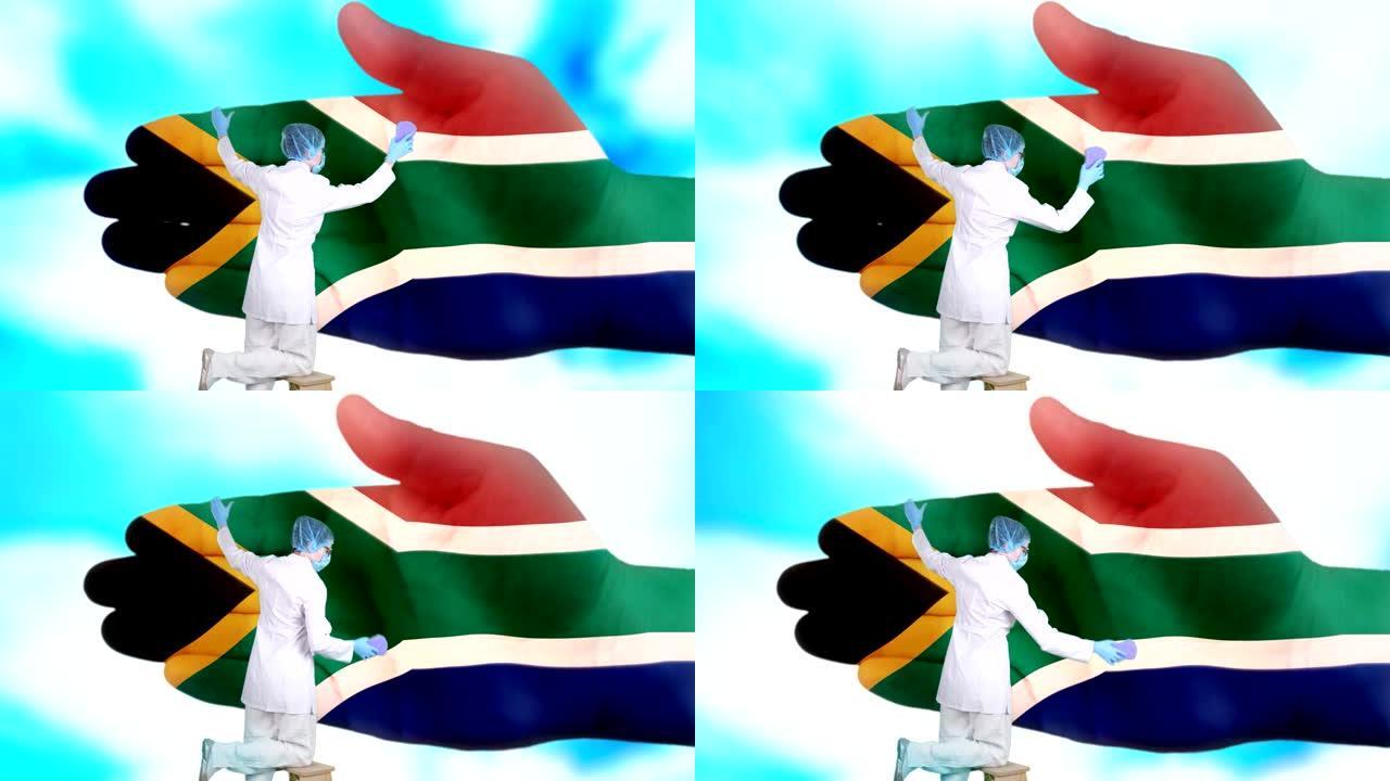 戴着医用口罩和手套的护士洗大手，涂上南非共和国国旗的颜色。国家保健。洗手概念。病毒保护。疾病预防