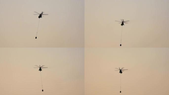 Mi-17直升机为森林大火运送水桶