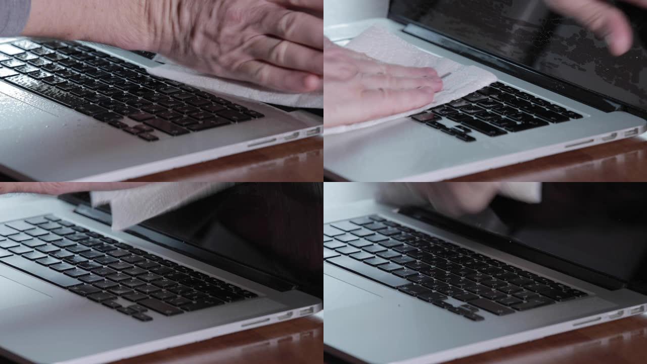 男士双手清洁笔记本电脑防腐喷雾，特写视频，纸巾，在冠状病毒大流行期间消毒手部皮肤，新型冠状病毒肺炎流