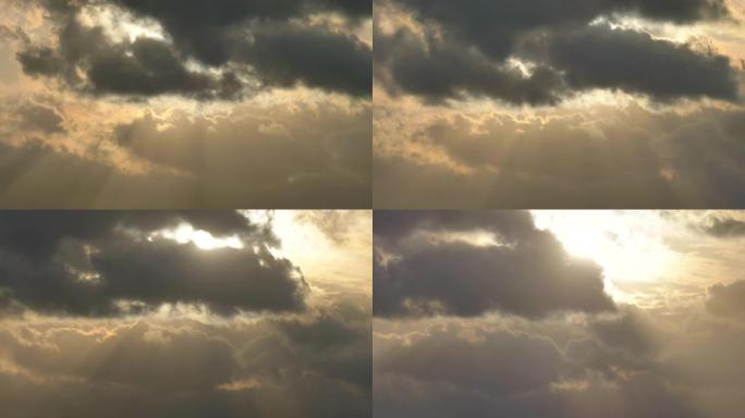 太阳在云间移动并最终出来的延时镜头，乌云和明亮的阳光，4k视频。