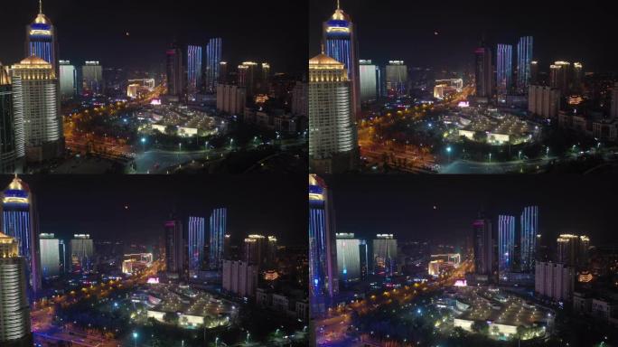 夜灯青岛市市中心著名购物中心交通街道航空全景4k中国