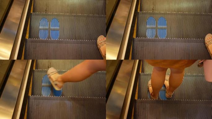 POV，女人脚走在自动扶梯上，地板上的新型冠状病毒肺炎商务标牌，新的正常概念
