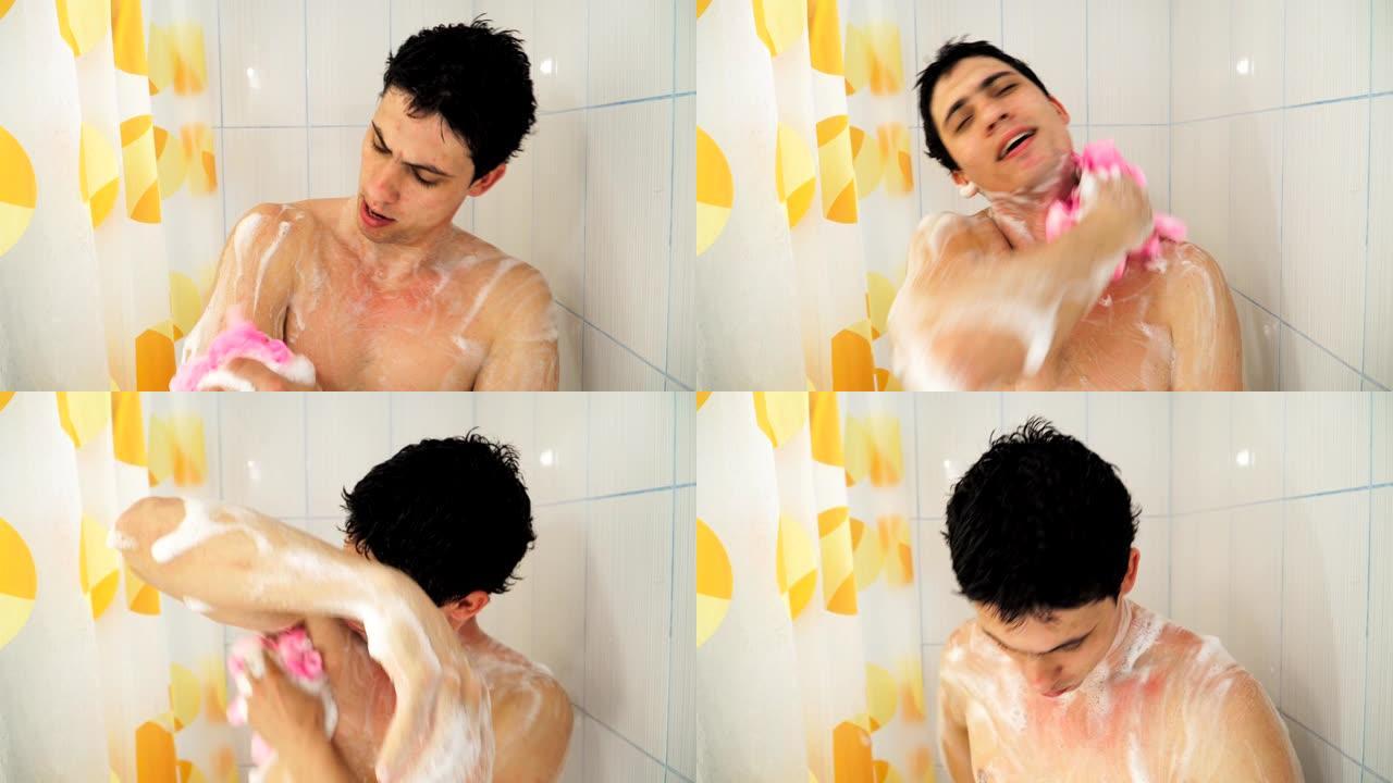 一个年轻的白种人洗着有肥皂味的粉色毛巾。有趣的裸男在浴室洗澡和唱歌。