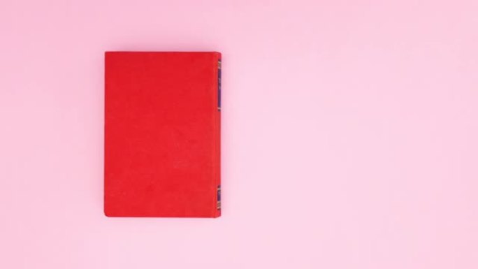 红皮书出现在粉红色背景上-停止运动
