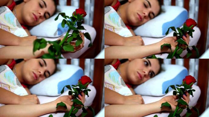浪漫的男朋友在床上给女友送玫瑰