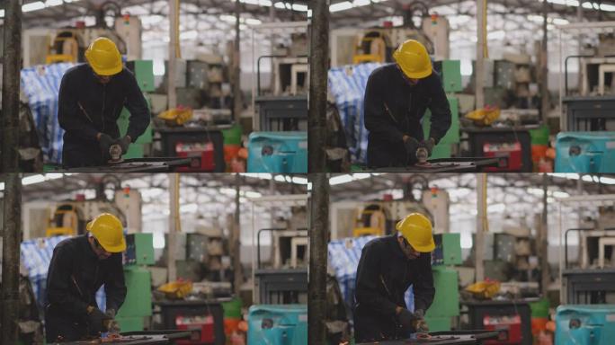 深蓝色均匀的技术人员使用抛光机对钢板进行抛光会导致工厂工作场所出现一些闪光