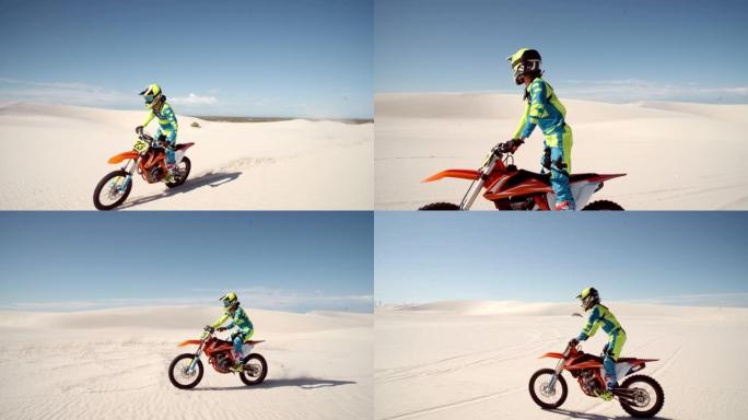 摩托车手骑着自行车穿越沙丘