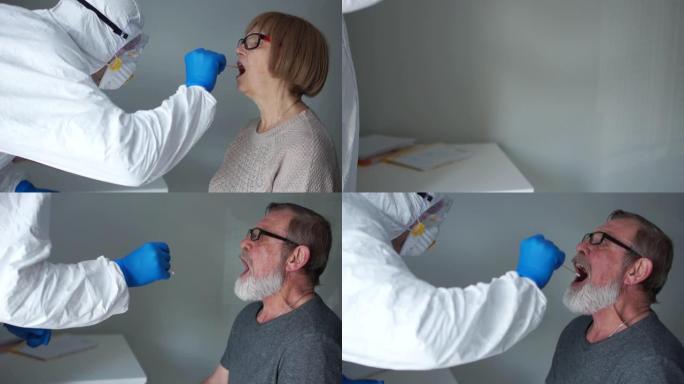 穿着防护服的医生从一位老年妇女的养老金领取者的喉咙上取了一个拭子，然后从她的丈夫那里取了一个拭子。P
