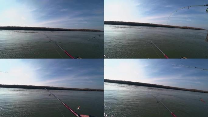 在晴朗的天气里，渔民在美丽的河上的旋转竿上钓鱼，第一人称视角