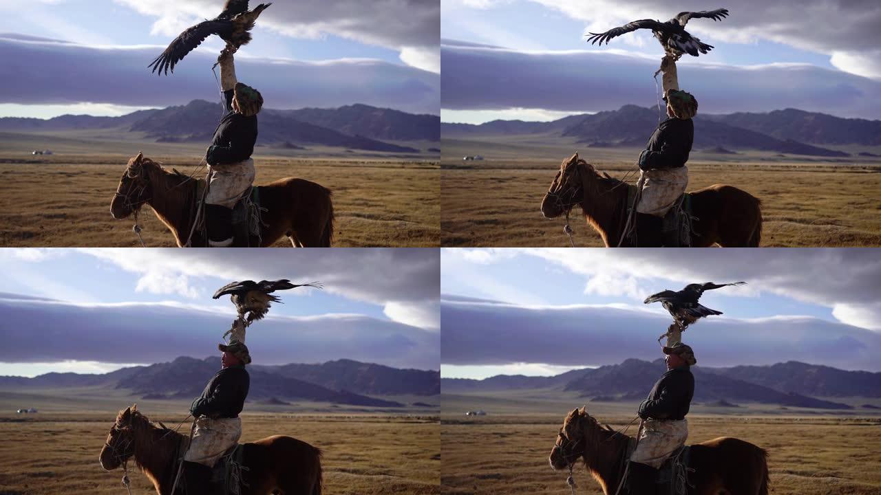 蒙古沙漠中骑着马的猎鹰者