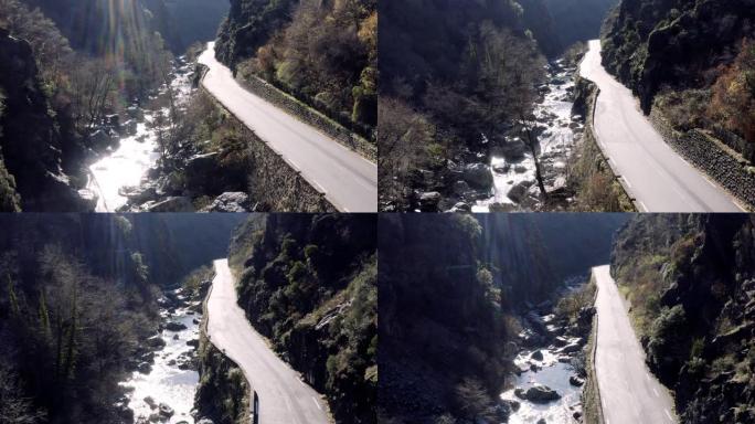 沿路的山河，空中全景无人机可以看到风景秀丽的高速公路，被云雾覆盖的美丽景观，桥梁和高架桥，沿路的山河