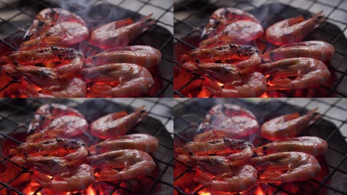 虾在传统的炉子上烧烤。美味的泰国海鲜菜单。泰国街头美食菜单。燃烧木炭，下面有热火焰。热门菜单，适合野