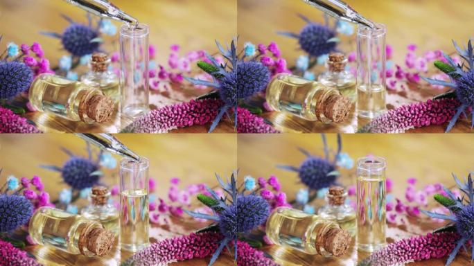 调香师创造新的芳香液体香水倒入精油在玻璃小瓶。