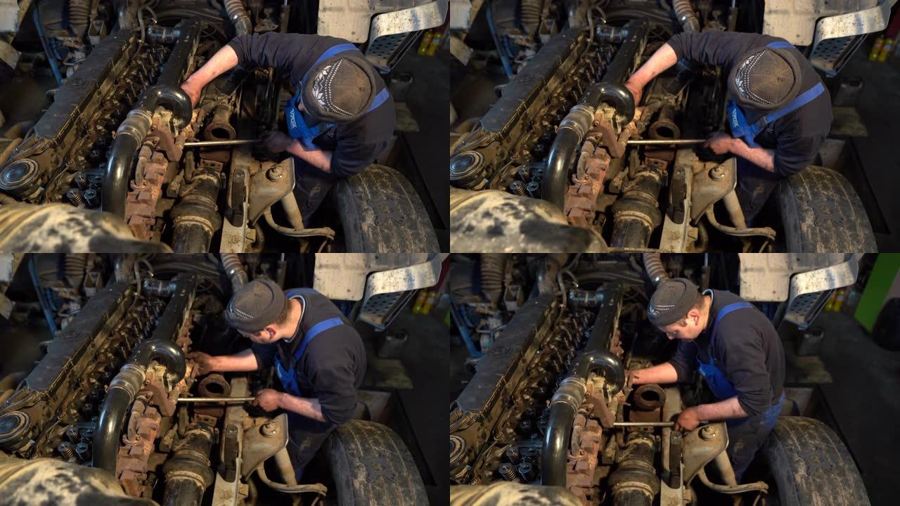 男子修理卡车的发动机